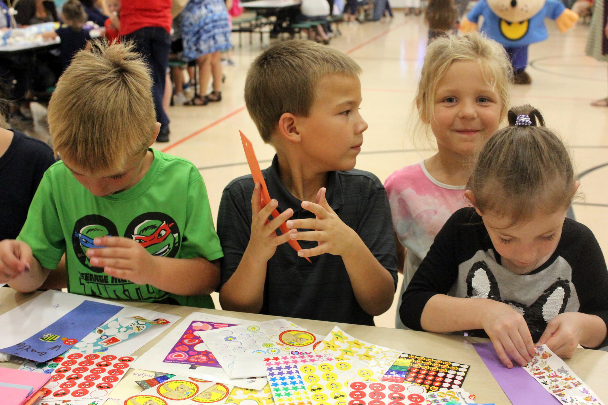 group of kids playing with stickers - Kingston K-14